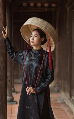 Taking pictures in traditional costumes in an ancient house in Hoi An, Vietnam