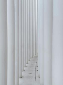 Symmetrical white columns forming a modern architectural detail in Luxembourg.