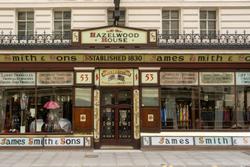 Historic James Smith & Sons shopfront in London showcasing vintage umbrella display.