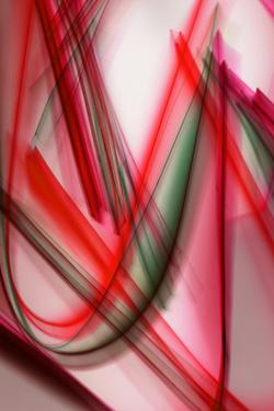 Vibrant abstract light trails in red and green creating a dynamic visual pattern.