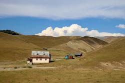 Scenic view of quaint houses set against Artvin's rolling hills.