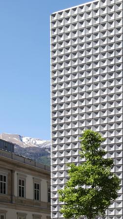 A striking brutalist building stands tall against a clear sky in Chur, Switzerland.